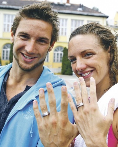 Shane Tusup and Katinka Hosszú showing their rings – just married.