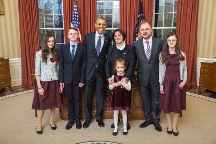 Ms. Szemerkényi with her family and President Obama in the Oval Office.