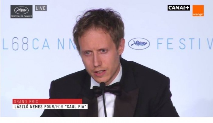 László Nemes accepts his award at the Cannes film festival. 