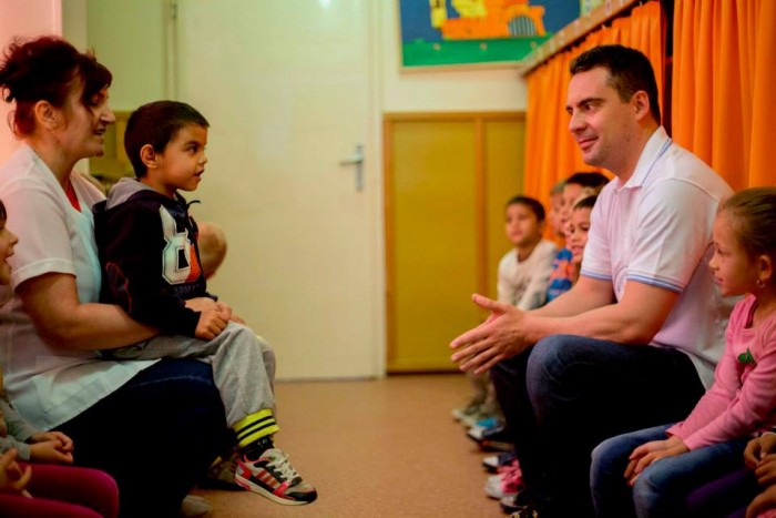 Gábor Vona at a kindergarten in the town of Ózd. This is just one o more than a  dozen photos that Mr. Vona posted to Facebook of him playing, talking, eating and telling stories to small children. 