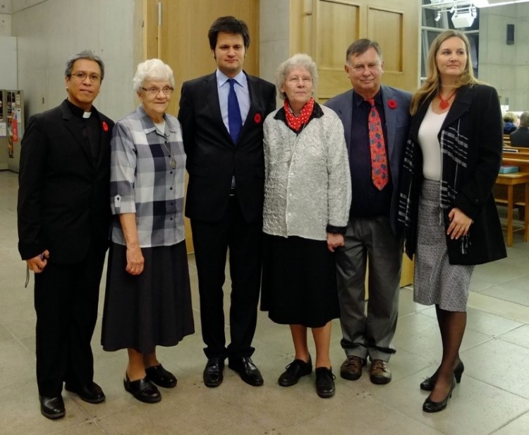 Father Brando Recana (left), two Sisters of Social Service and Ambassador Bálint Ódor (blue tie), filmmaker George Csicsery and Consul General Stefánia Szabó at St. Gabriel's Passionist Church.
