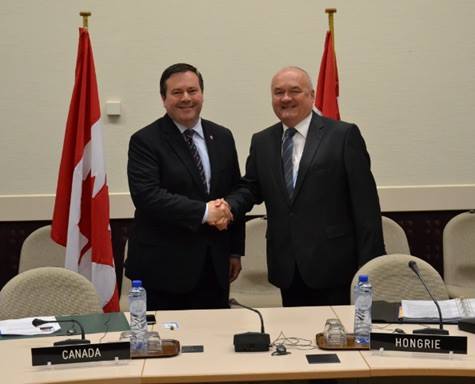 Jason Kenney (left) goes out of its way to commend the Orbán regime.