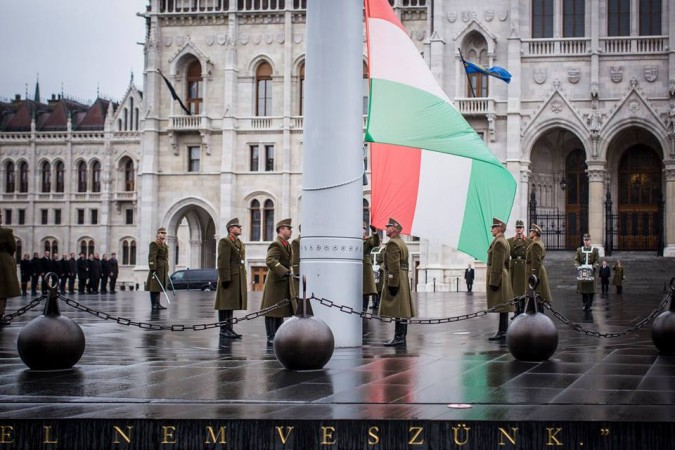 The ceremonial guard position Hungary's flag at half mast in front of Parliament, on the national day of mourning. Photo: Facebook.