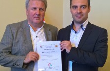 Mr. Baumeister (left) receives his accreditation from Jobbik Party Chairman Mr. Vona.