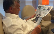 Mr. Orbán reads the cover page of the pro-government Magyar Idők daily, which features a headline warning readers about the risks of Hungary turning into an Islamic caliphate.